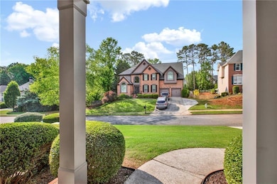 View of green lawn featuring concrete driveway