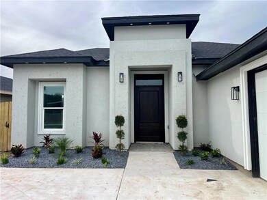 Doorway to property with a patio area