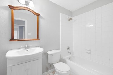 Full bathroom with vanity, tiled shower / bath, an