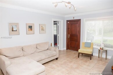Neutral tile throughout the living areas and light