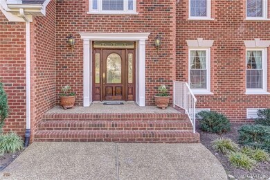 The extra-wide aggregate and brick front entry mak