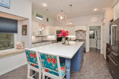 Large kitchen includes a cozy window seat.