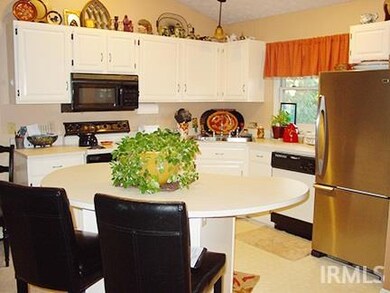 Nice size kitchen with large kitchen island for extra counter space and storage.