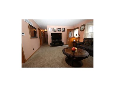 Living Room measures 18'x14'.6
