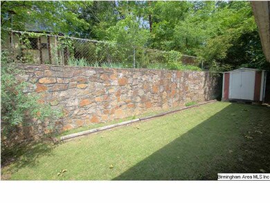 Lower level backyard toward shed / BBQ area and pa