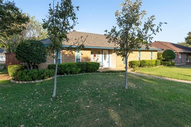 Single story home featuring a front yard