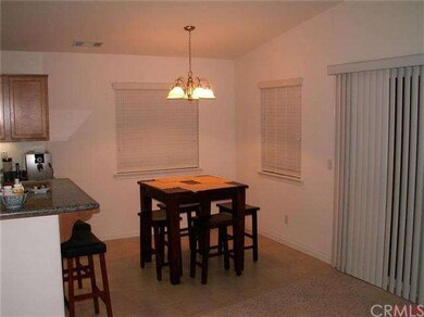 Dining area with tiled floor and sliding door to a