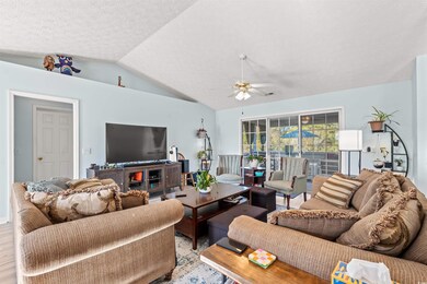 Living room featuring a textured ceiling, ceiling 