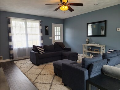 additional view of family room- exit to front of h