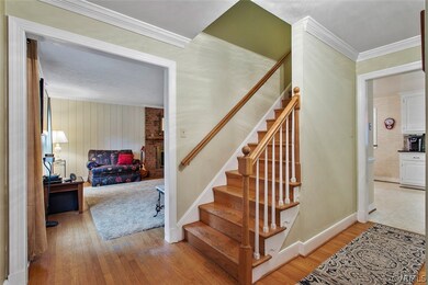 Foyer view into the family room, stairway to the 2