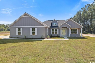 View of front facade featuring a front yard