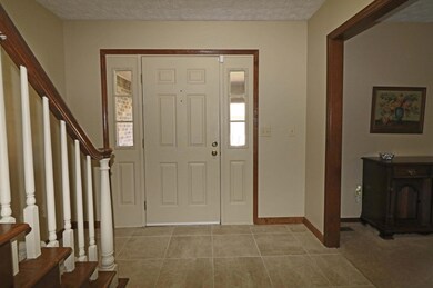 Foyer with ceramic tile floor