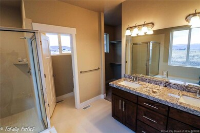 GRAND MASTER BATH FEATURING GRANITE COUN