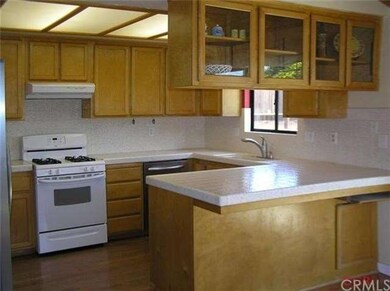 Kitchen view from living room.  Lots of cabinets a