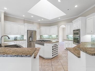 Open island kitchen with built-in wine rack in the
