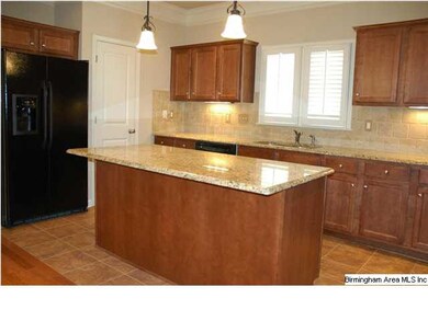 Large open kitchen with granite counters.