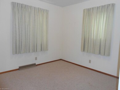 Secondary bedroom to the left at the end of the ha