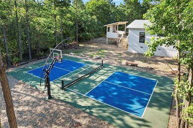 View of basketball court with tennis court