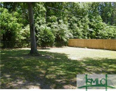 Yard/Garden. Large wooded backyard is fenced