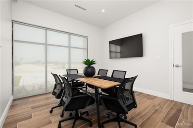 Office featuring wood tiled floors and recessed lighting