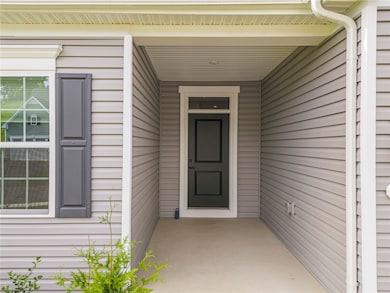 Covered concrete entry.