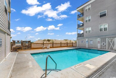 View of swimming pool with a deck