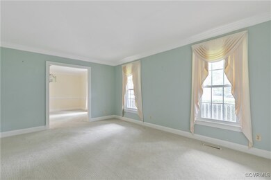 Living room featuring crown molding, HW underneath