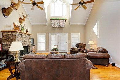 The open living room features cathedral ceilings.  Lots of natural light throughout the house.