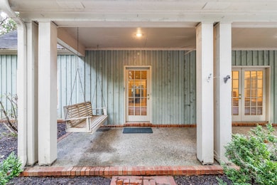 Property entrance with board and batten siding