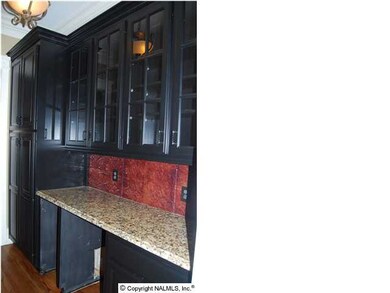 Butlers pantry with room for ice maker, wine fridge and coffee or drinks set up. Plenty of storage for glassware or china, pull out shelves in large cupboard.