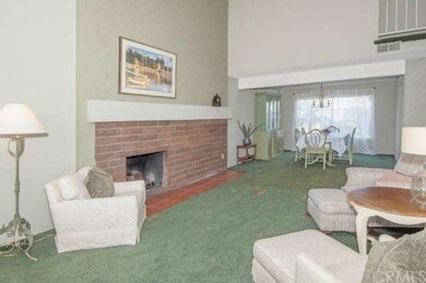Fireplace in Living Room that opens to Formal Dini