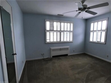 Bedroom with interior shutters.