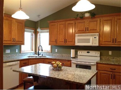 Updated kitchen with granite counter tops.