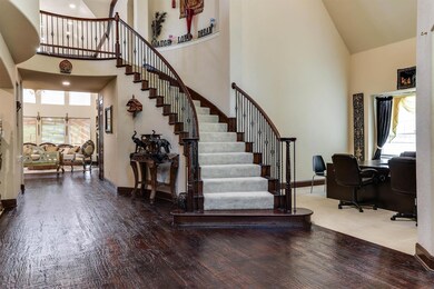 Entrance foyer featuring hardwood / wood-style flo