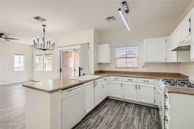 Kitchen featuring white appliances, under cabinet