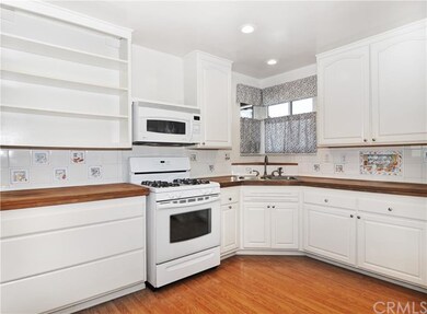 Large, clean, and bright kitchen with classic wood