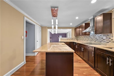 Kitchen with a center island, ornamental molding, 