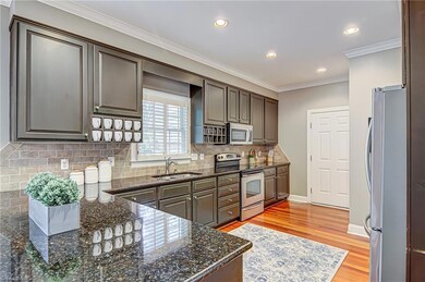 This beautiful kitchen is steps from the dining room, making entertaining a breeze!