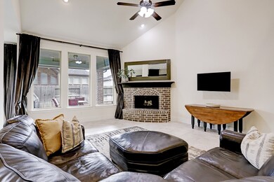 The focal point of the Famiy room is the vaulted ceiling, fireplace, and triple windows.