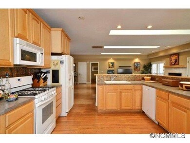 KITCHEN OPENS TO GREAT ROOM