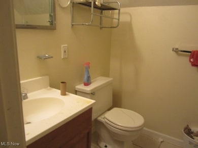 3rd flr Bathroom with tile patterned floors, toilet, and vanity