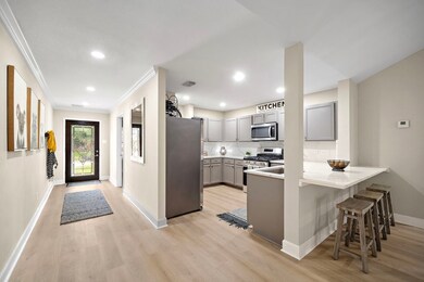 Closer view of the kitchen.   Stainless steel appl