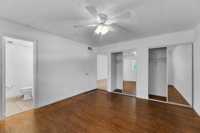 Double closets and en-suite bathroom features bedr
