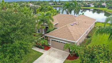 New roof and new Exterior paint, lush tropical landscaping with Banana and Citrus Tree surround 364 Snapdragon Loop, Bradenton, FL 34212