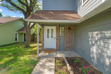 Property entrance with brick siding, roof with sh