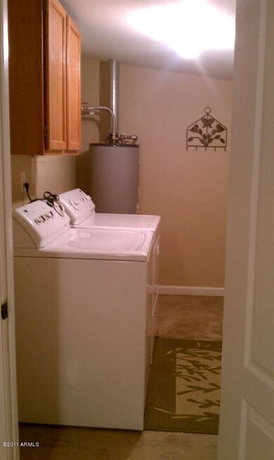 inside laundry room with washer and drye