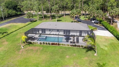 View of subject property featuring a pool area
