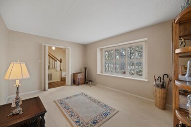 Off the entry to the left is the formal living room. Would make a great study or office as well.