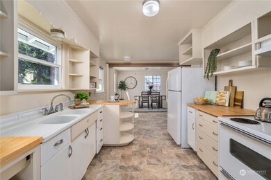 Updated kitchen with butcher block counters and lots of room for storage.