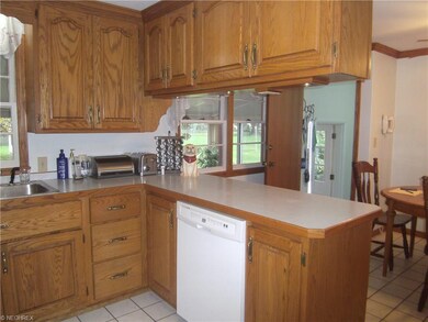 kitchen serving island.  Lots of oak Kraft Maid Ca